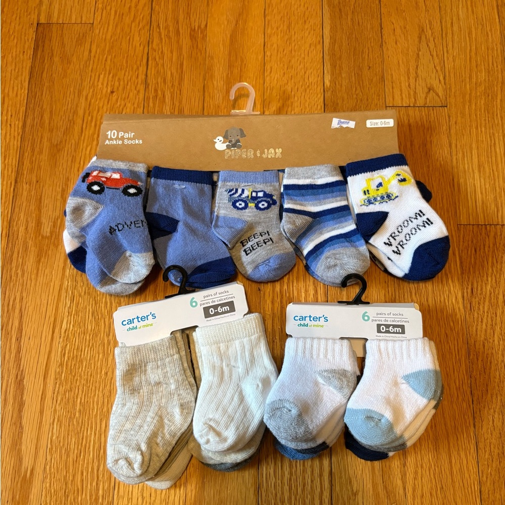 Baby socks size 0-6 months blue, white, cream featuring trucks